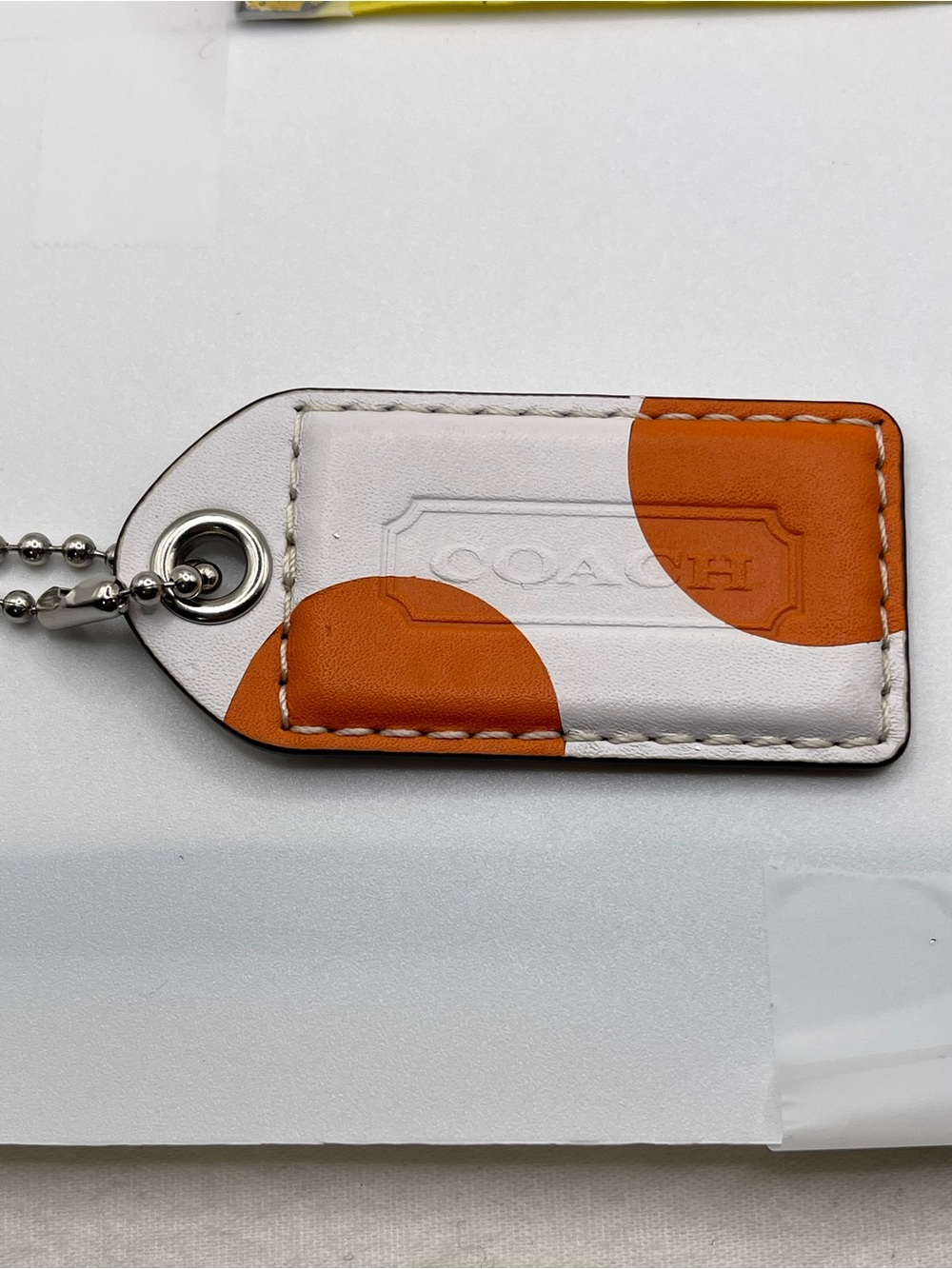 Coach XL White with Orange Dots Leather Hang Tag with Metal Ball Chain
